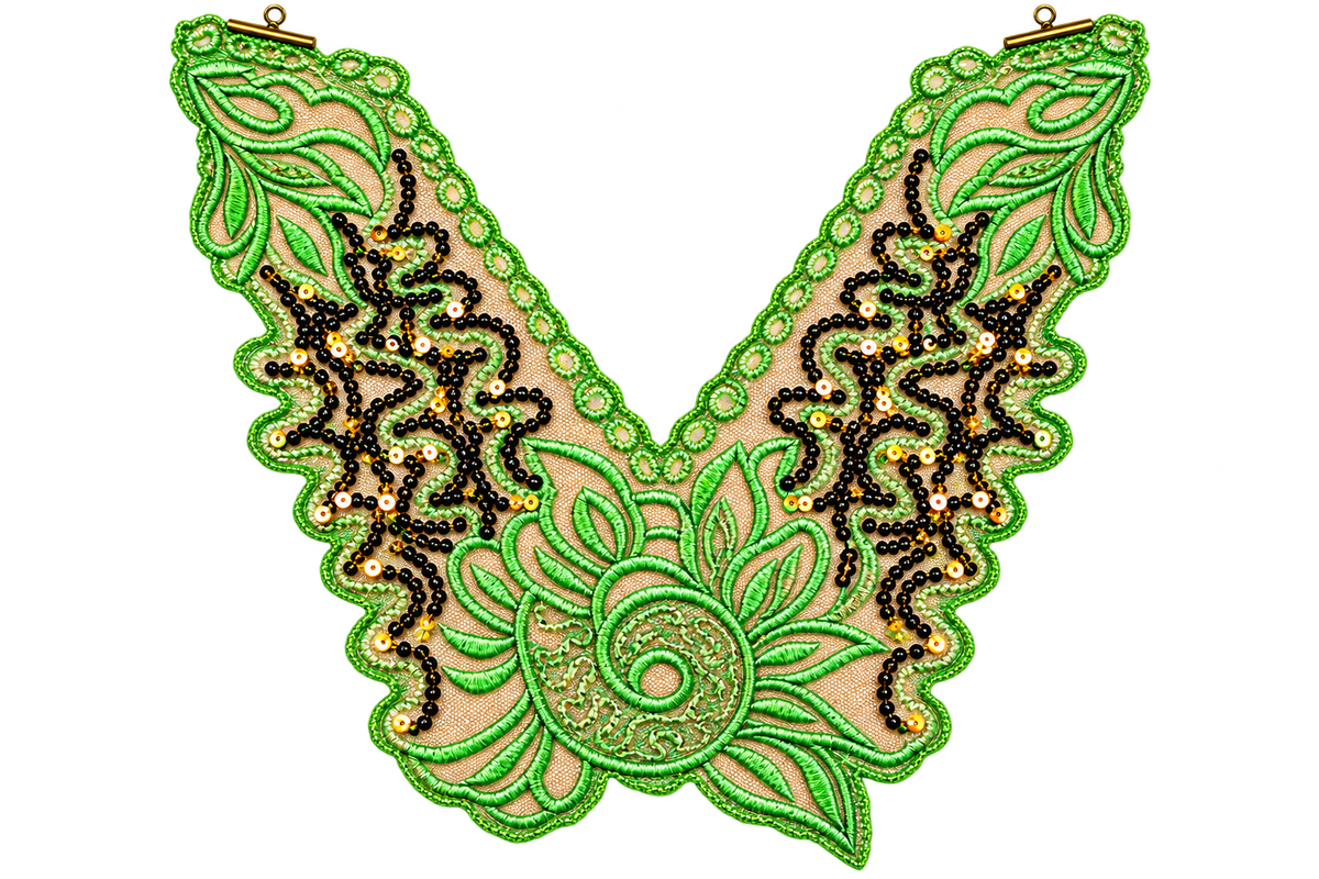 A V-shaped embroidered applique or collar piece featuring bright green beaded leaf patterns, black beaded scrollwork, and a central spiral floral motif on a beige mesh backing, shown against a plain white background.